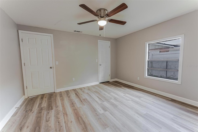 635 San Lanta Cir, Sanford, FL 32771 - unfurnished bedroom featuring light wood-type flooring, baseboards, and a ceiling fan