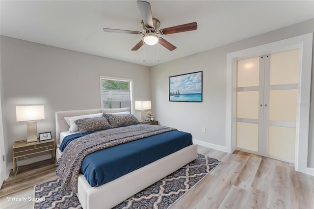 635 San Lanta Cir, Sanford, FL 32771 - bedroom featuring light wood-style flooring, baseboards, and a ceiling fan