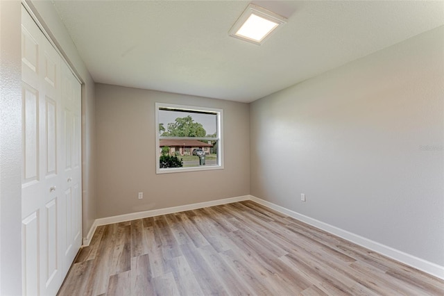 635 San Lanta Cir, Sanford, FL 32771 - unfurnished bedroom featuring light wood-style floors, baseboards, and a closet