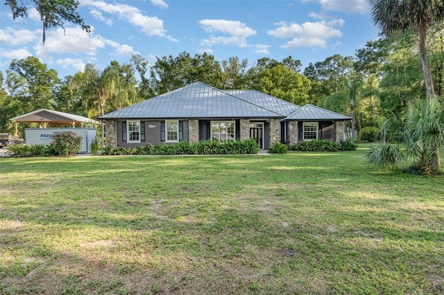 433 Tangerine Ave, Lake Helen, FL 32744 - ranch-style house featuring a front yard, a standing seam roof, and metal roof