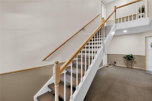 5395 Dover Village Ln Unit 305, Orlando, FL 32812 - stairs featuring carpet floors, baseboards, and a towering ceiling