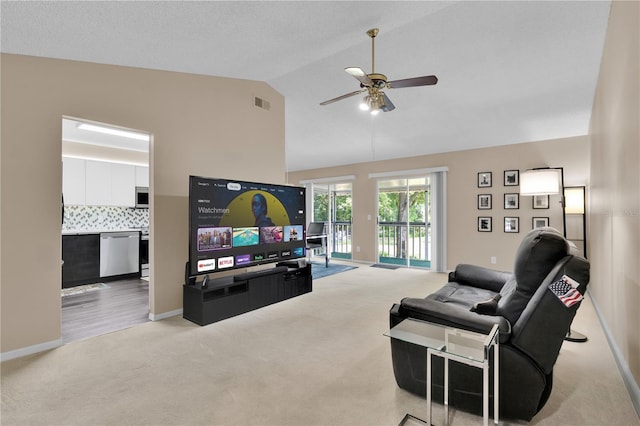 5395 Dover Village Ln Unit 305, Orlando, FL 32812 - living area with light colored carpet, a ceiling fan, lofted ceiling, and baseboards