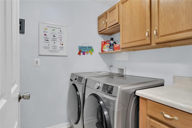 5395 Dover Village Ln Unit 305, Orlando, FL 32812 - laundry room featuring washing machine and clothes dryer, cabinet space, and baseboards