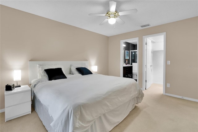 5395 Dover Village Ln Unit 305, Orlando, FL 32812 - bedroom with light carpet, baseboards, a spacious closet, and connected bathroom