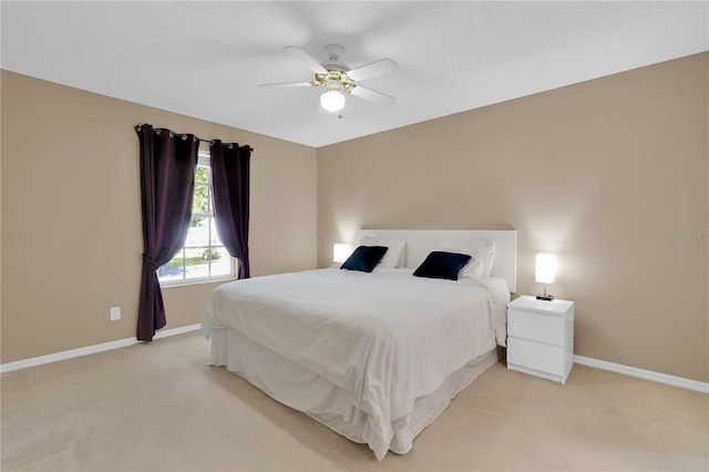 5395 Dover Village Ln Unit 305, Orlando, FL 32812 - bedroom with light colored carpet, baseboards, and ceiling fan