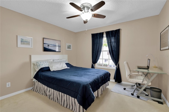5395 Dover Village Ln Unit 305, Orlando, FL 32812 - bedroom with carpet, baseboards, a textured ceiling, a ceiling fan, and a desk