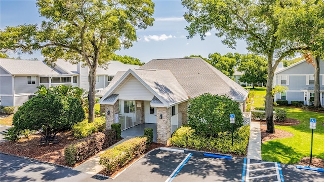 5395 Dover Village Ln Unit 305, Orlando, FL 32812 - view of front of home featuring brick siding, uncovered parking, and covered porch