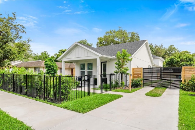 2110 Hillcrest St, Orlando, FL 32803 - bungalow-style home with a porch, a fenced front yard, stucco siding, and roof with shingles