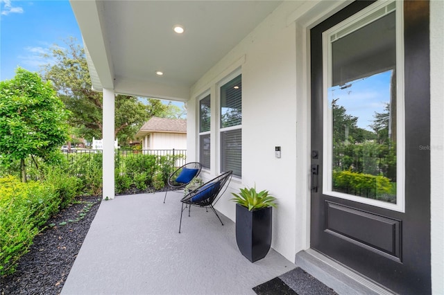 2110 Hillcrest St, Orlando, FL 32803 - view of patio featuring a porch and fence