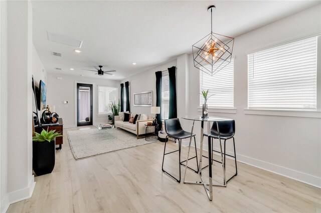 2110 Hillcrest St, Orlando, FL 32803 - living area with light wood finished floors, baseboards, a chandelier, and recessed lighting