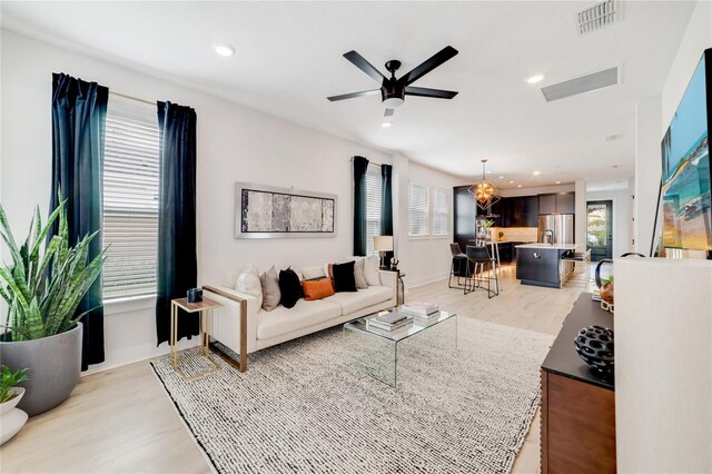 2110 Hillcrest St, Orlando, FL 32803 - living area with light wood-type flooring, baseboards, a ceiling fan, and recessed lighting