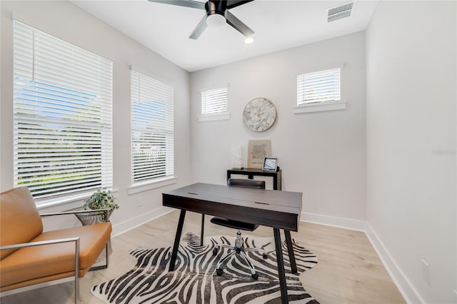2110 Hillcrest St, Orlando, FL 32803 - home office with plenty of natural light, baseboards, ceiling fan, and light wood finished floors