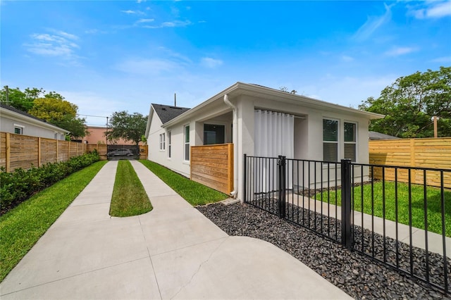 2110 Hillcrest St, Orlando, FL 32803 - view of property exterior with a fenced backyard and stucco siding