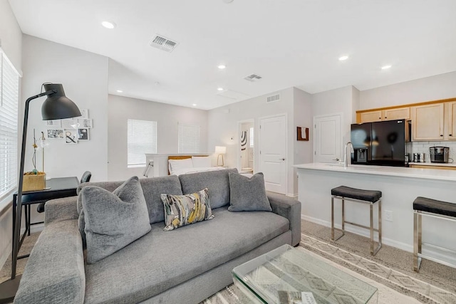 2110 Hillcrest St, Orlando, FL 32803 - living area with plenty of natural light, light colored carpet, recessed lighting, and baseboards