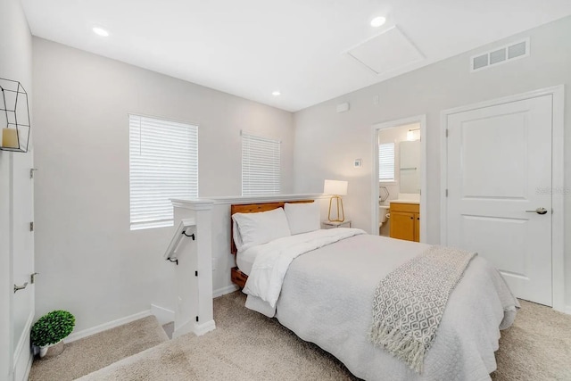 2110 Hillcrest St, Orlando, FL 32803 - bedroom with light colored carpet, attic access, baseboards, recessed lighting, and ensuite bathroom