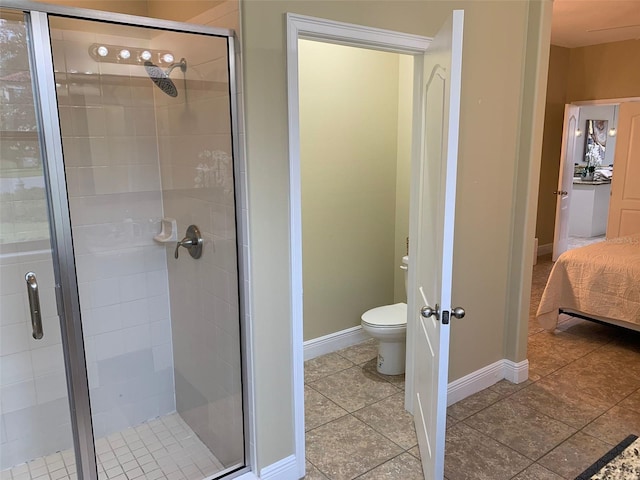 8124 Roseville Rd, Davenport, FL 33896 - ensuite bathroom with toilet, tile patterned flooring, a shower stall, and baseboards