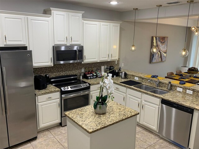 8124 Roseville Rd, Davenport, FL 33896 - kitchen featuring stainless steel appliances, light tile patterned flooring, a sink, and backsplash