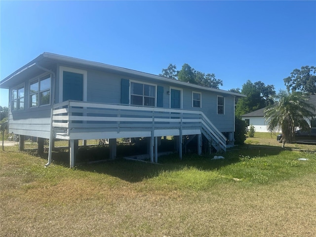 14330 Ellerbee St, Winter Garden, FL 34787 - back of property featuring a lawn and stairway