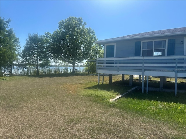 14330 Ellerbee St, Winter Garden, FL 34787 - view of grassy yard featuring a deck with water view
