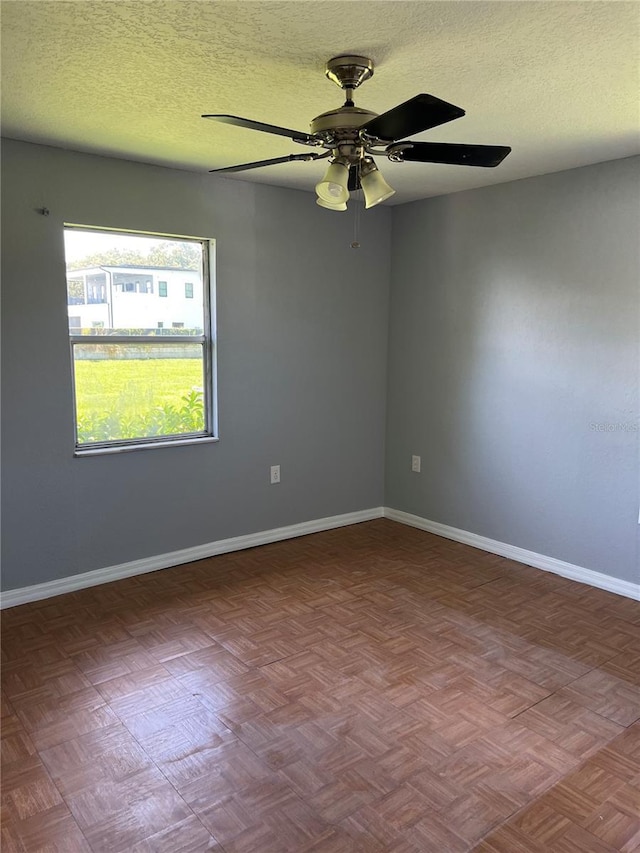 14330 Ellerbee St, Winter Garden, FL 34787 - empty room featuring a ceiling fan, a textured ceiling, and baseboards