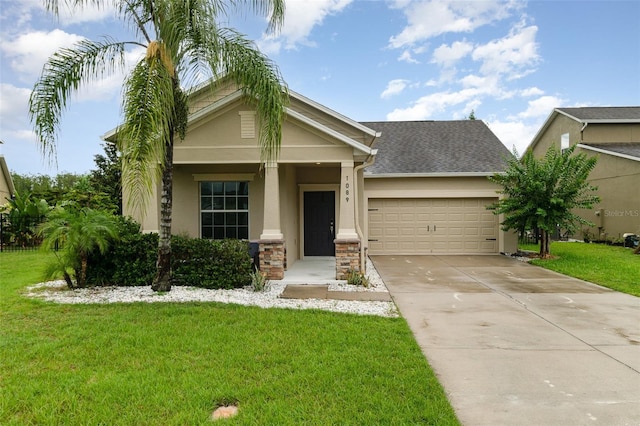 1089 Seburn Rd, Apopka, FL 32703 - view of front of home with stucco siding, an attached garage, concrete driveway, a front lawn, and stone siding