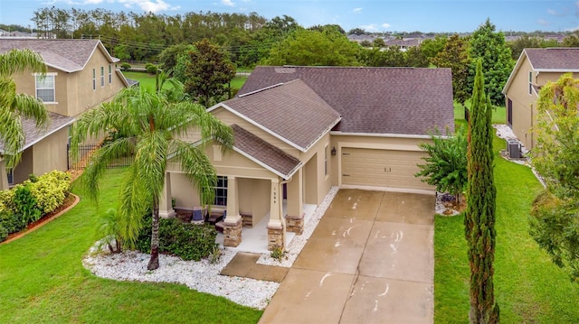 1089 Seburn Rd, Apopka, FL 32703 - view of front of house with an attached garage, concrete driveway, stucco siding, covered porch, and cooling unit