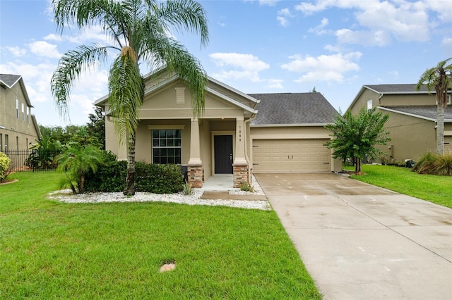 1089 Seburn Rd, Apopka, FL 32703 - view of front of property with stucco siding, an attached garage, and driveway