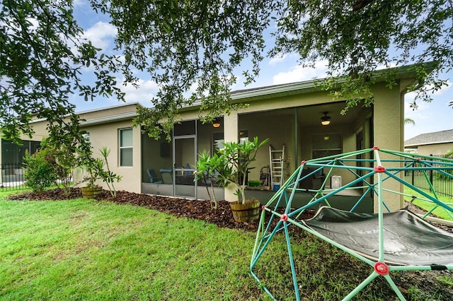1089 Seburn Rd, Apopka, FL 32703 - rear view of house with a sunroom and stucco siding
