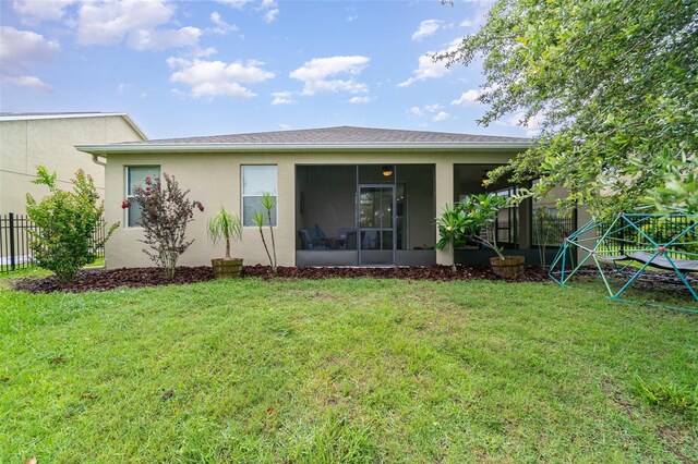 1089 Seburn Rd, Apopka, FL 32703 - back of house with a sunroom and stucco siding