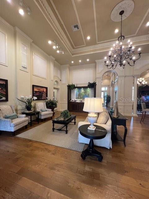 14531 Pleach St, Winter Garden, FL 34787 - common area with crown molding, a high ceiling, a decorative wall, and recessed lighting