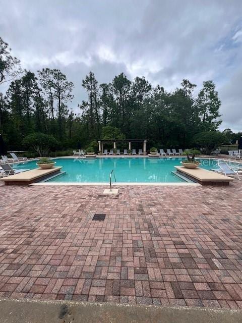 14531 Pleach St, Winter Garden, FL 34787 - community pool featuring a patio