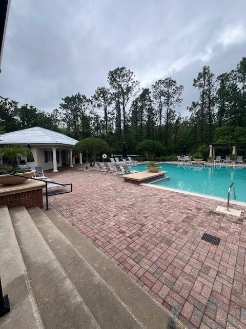 14531 Pleach St, Winter Garden, FL 34787 - community pool featuring a patio area