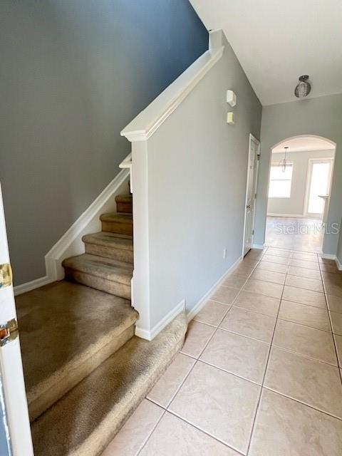 14531 Pleach St, Winter Garden, FL 34787 - stairway with arched walkways and tile patterned floors