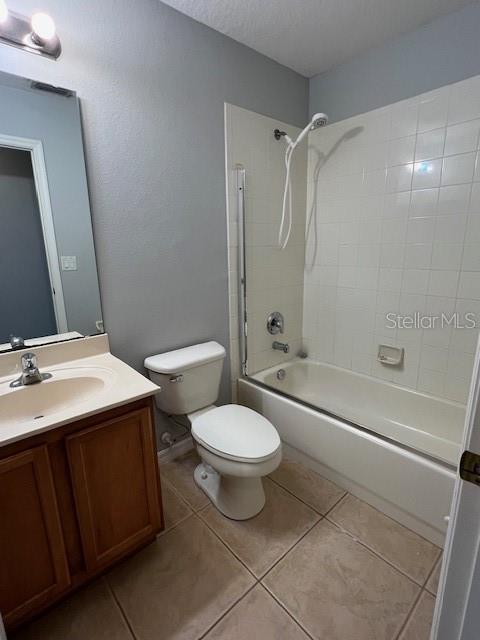 14531 Pleach St, Winter Garden, FL 34787 - bathroom with vanity, washtub / shower combination, and tile patterned floors