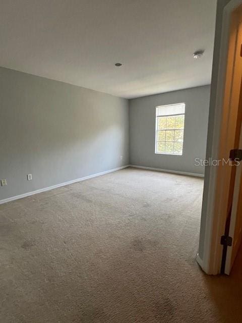 14531 Pleach St, Winter Garden, FL 34787 - spare room featuring baseboards and carpet floors