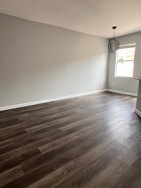 14531 Pleach St, Winter Garden, FL 34787 - unfurnished room featuring dark wood finished floors and baseboards