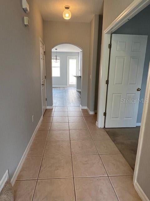 14531 Pleach St, Winter Garden, FL 34787 - hall featuring arched walkways and light tile patterned floors