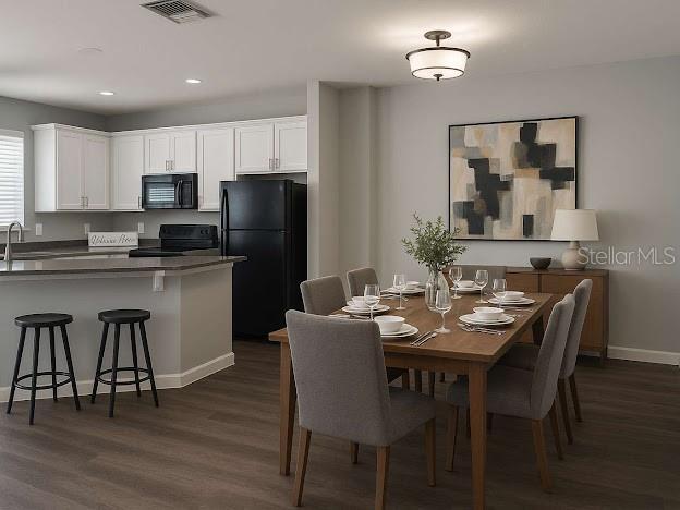 14531 Pleach St, Winter Garden, FL 34787 - dining space featuring dark wood finished floors and recessed lighting