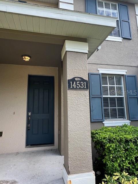 14531 Pleach St, Winter Garden, FL 34787 - entrance to property with stucco siding