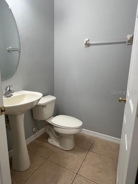 14531 Pleach St, Winter Garden, FL 34787 - half bathroom featuring toilet and tile patterned floors
