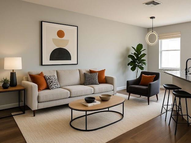 14531 Pleach St, Winter Garden, FL 34787 - living area featuring dark wood-style flooring and baseboards