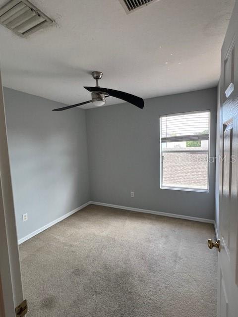 14531 Pleach St, Winter Garden, FL 34787 - spare room featuring carpet and a ceiling fan
