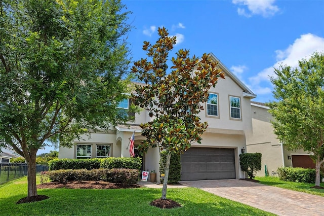 646 Marsh Reed Dr, Winter Garden, FL 34787 - view of front facade with a garage, decorative driveway, and stucco siding