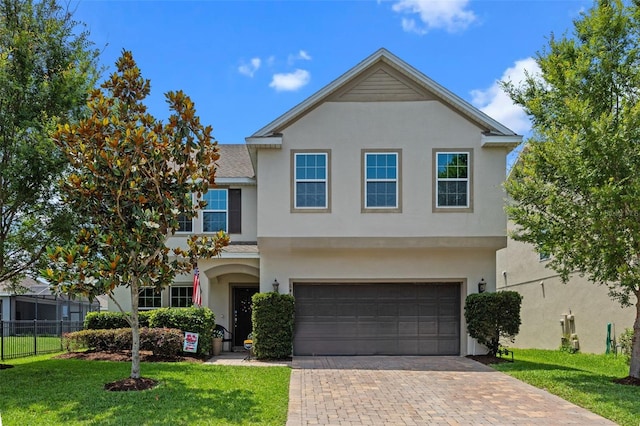 646 Marsh Reed Dr, Winter Garden, FL 34787 - traditional home with stucco siding, an attached garage, and decorative driveway