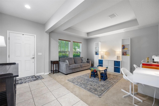 646 Marsh Reed Dr, Winter Garden, FL 34787 - living room with a raised ceiling, light tile patterned flooring, light carpet, and recessed lighting
