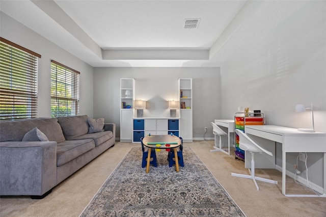 646 Marsh Reed Dr, Winter Garden, FL 34787 - living room with light carpet and a tray ceiling