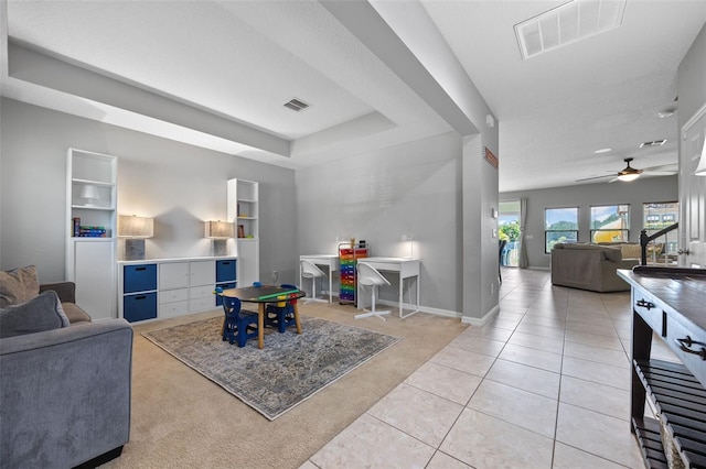 646 Marsh Reed Dr, Winter Garden, FL 34787 - living room featuring light tile patterned flooring, light colored carpet, and a ceiling fan