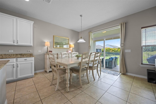 646 Marsh Reed Dr, Winter Garden, FL 34787 - dining area featuring plenty of natural light and light tile patterned floors