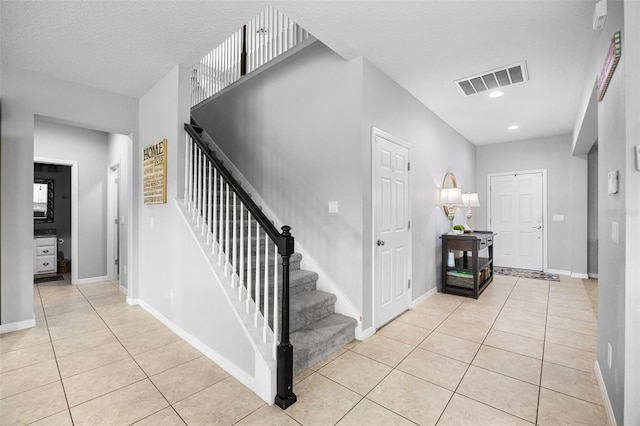 646 Marsh Reed Dr, Winter Garden, FL 34787 - entryway with light tile patterned flooring, stairway, and recessed lighting