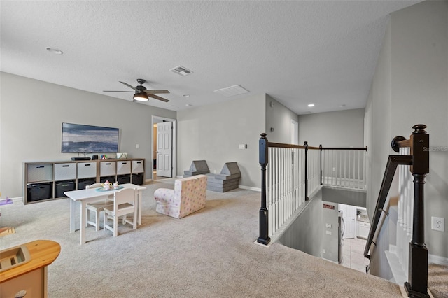 646 Marsh Reed Dr, Winter Garden, FL 34787 - carpeted living room featuring ceiling fan, a textured ceiling, and recessed lighting